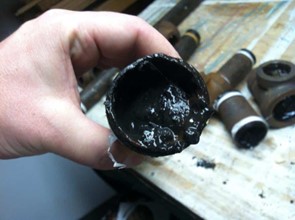 Heavily fouled with solids